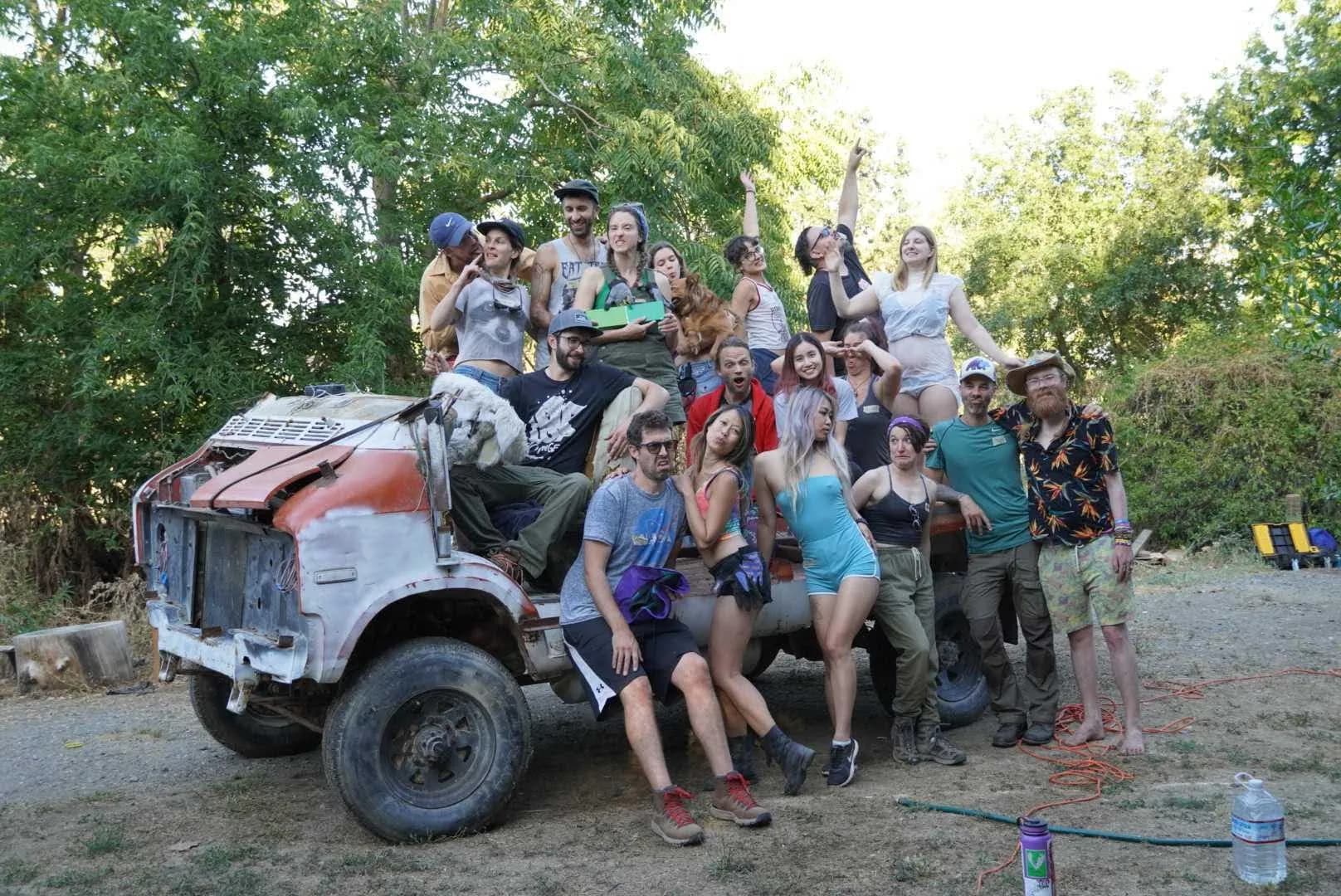 The whole crew piled onto the bare donor truck, covered in dust and grinning